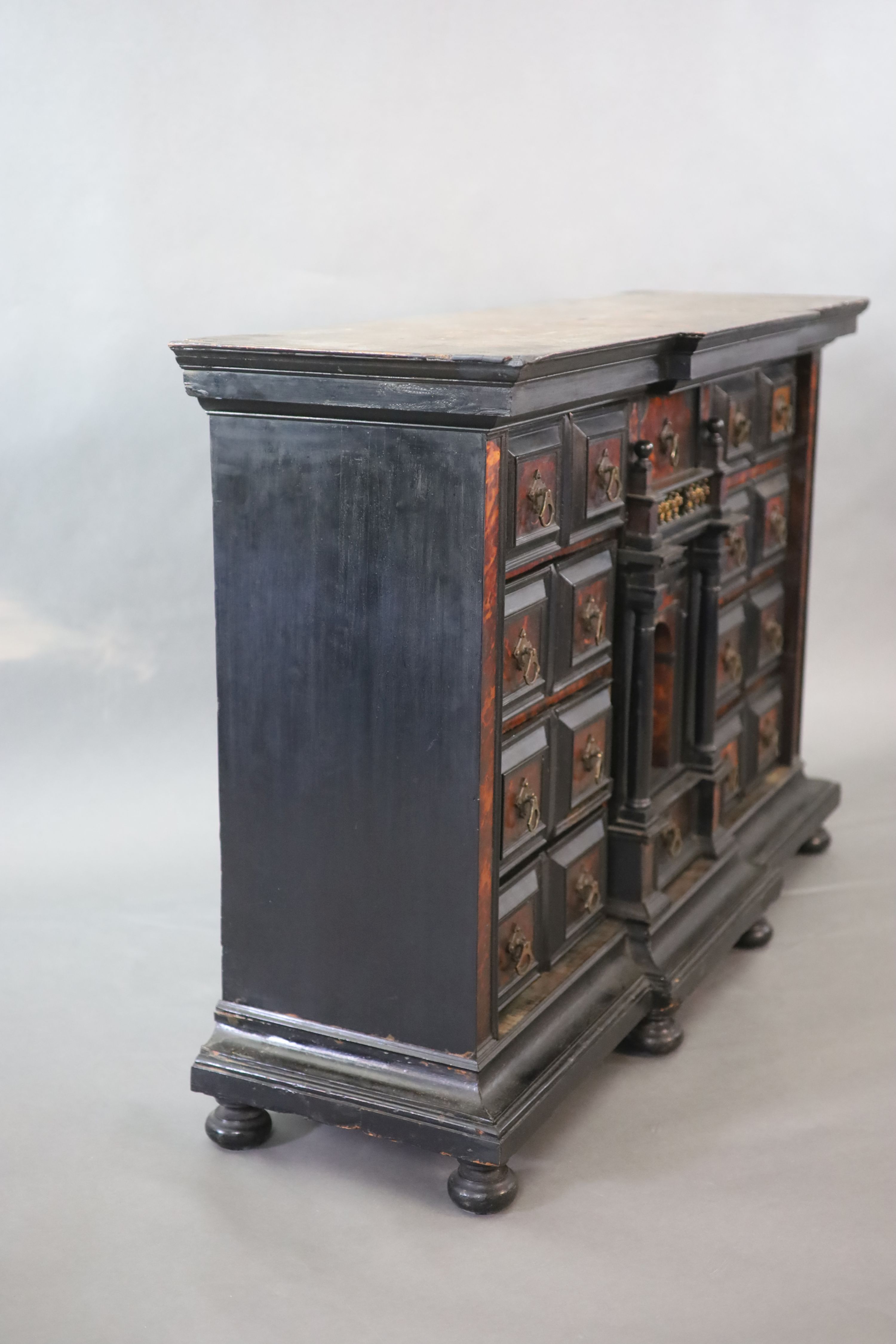 A late 17th century Portuguese ebony and tortoiseshell table cabinet, W.128cm D.39cm H.85cm